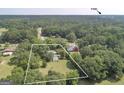 Aerial view of a home with a clearly outlined boundary and mature trees at 306 Tyrone Rd, Fayetteville, GA 30214