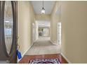 Grand foyer with hardwood accents, carpet, and a view to living room with fireplace at 545 Grand Teton Cir, Fayetteville, GA 30215