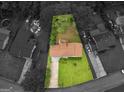 An aerial view of the property shows the home's location on a landscaped lot with mature trees and a driveway at 8310 Meridian Dr, Riverdale, GA 30274
