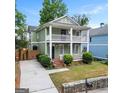 Inviting home with a spacious front yard and charming porch, perfect for enjoying the outdoors at 187 Vanira Se Ave, Atlanta, GA 30315