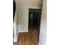 Inviting entryway featuring sleek hardwood floors and neutral gray walls, leading to spacious living areas at 2756 Norfair Loop, Lithonia, GA 30038