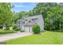 Charming two-story home with a well-manicured lawn and attached two-car garage at 4959 Abbotts Glen Nw Trl, Acworth, GA 30101