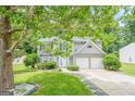 Charming two-story home with a well-manicured lawn and attached two-car garage at 4959 Abbotts Glen Nw Trl, Acworth, GA 30101