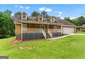 Charming home with a front porch, dormer windows, and well-maintained lawn at 2000 Stacia Dr, Covington, GA 30016