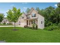 Beautiful home with brick and siding, landscaped yard, and attached garage offers charm and curb appeal at 5662 Valley Loop, Fairburn, GA 30213