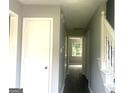 Inviting hallway featuring a staircase and neutral paint tones, enhancing the home's spacious feel at 6650 Smoke Ridge, Atlanta, GA 30349