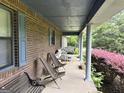 Relaxing front porch with seating area, perfect for enjoying the outdoors at 260 Willis Rd, Sharpsburg, GA 30277