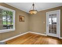 Cozy dining area featuring hardwood floors, a stylish light fixture, and natural light at 1042 Faith Se Ave, Atlanta, GA 30316