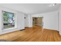 Spacious living room featuring hardwood floors and an open layout with natural light at 1042 Faith Se Ave, Atlanta, GA 30316
