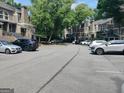 Parking lot filled with many vehicles and surrounded by trees at 17 Brittany Ne Way, Atlanta, GA 30324