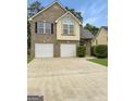 Attractive two-story home featuring a brick facade, two-car garage, and well-maintained landscaping at 120 Hawken Trl, Mcdonough, GA 30253