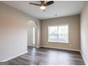 Inviting living room with dark wood floors, large window, and open layout at 1849 Wanda Way, Ellenwood, GA 30294