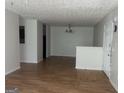 This large living room has laminate floors and neutral-colored walls that offer a versatile space at 14104 Fairington Ridge Cir, Lithonia, GA 30038