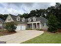 Charming home with manicured lawn, inviting entrance, and attached two-car garage for convenient living at 237 Shockley Way, Dallas, GA 30157
