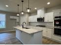 Modern kitchen featuring granite countertops, stainless steel appliances, and pendant lighting at 3019 Beverly Ct, Mcdonough, GA 30252