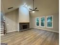 Spacious living room with vaulted ceilings, stone fireplace and abundant natural light at 3019 Beverly Ct, Mcdonough, GA 30252