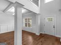 Elegant foyer with hardwood floors, soaring ceilings, and a grand staircase at 149 Elkins Blvd, Locust Grove, GA 30248
