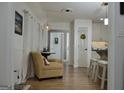 A view through doorway into the dining room and the kitchen with hardwood flooring at 219 Brown Branch Rd, Locust Grove, GA 30248