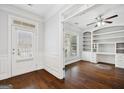 Bright office space featuring hardwood floors, built-in shelving, and ample natural light at 1220 Roswell Manor Cir, Roswell, GA 30076