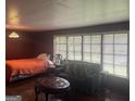Bedroom with large windows providing ample natural light at 1829 Joy Lake Rd, Morrow, GA 30260