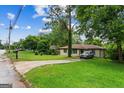 Single-story home with lush green lawn and a convenient driveway at 2835 Laguna Dr, Decatur, GA 30032