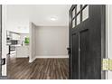 Inviting entryway into a naturally lit, open-concept living space with hardwood flooring at 2835 Laguna Dr, Decatur, GA 30032