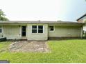 Exterior of the home with a concrete patio at 4540 Lindsey Dr, Powder Springs, GA 30127