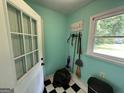 Stylish mudroom with black and white checkered flooring at 4540 Lindsey Dr, Powder Springs, GA 30127