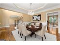Formal dining room featuring a chandelier, elegant furniture, and wainscoting at 917 Saints Ct, Marietta, GA 30068