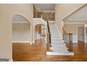 Spacious foyer with high ceilings, hardwood floors, and an elegant staircase at 917 Saints Ct, Marietta, GA 30068