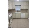 Functional kitchen design featuring white appliances and ample cabinet space at 207 Oak N Cir, Stockbridge, GA 30281