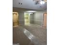 Open-concept living area with fresh paint and views into the bright kitchen at 207 Oak N Cir, Stockbridge, GA 30281