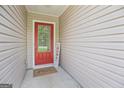 The front door with glass and a welcome mat at 107 Meadowbrook Ln, Grantville, GA 30220