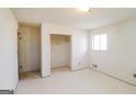 Bright, empty bedroom with white walls, an empty closet, and a window providing natural light at 2571 Beech St, Morrow, GA 30260