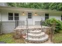 Close-up of home's front entrance with brick steps and wrought iron railings at 616 Inman Rd # B, Fayetteville, GA 30215
