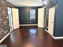 Bedroom with hardwood floors, fresh paint, and ample closet space at 7813 Sugarland Dr, Jonesboro, GA 30236