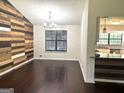 Living room with hardwood floors and a feature wall at 7813 Sugarland Dr, Jonesboro, GA 30236