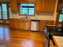 A kitchen with wooden cabinetry, stainless steel appliances, and light countertops at 823 Mountain View Run, Stone Mountain, GA 30087