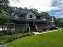 Inviting two-story home with a spacious front yard and a covered front porch at 3970 Governors Cir, Loganville, GA 30052