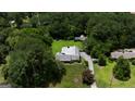 Expansive property featuring a spacious home, lush greenery, and a long driveway at 8815 Campbellton St, Douglasville, GA 30134