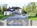 Beautiful modern home with mature trees, lush landscaping and a gated entry at 3181 Buck Branch Rd, Conyers, GA 30094