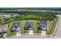 Aerial shot of a new-construction neighborhood, showcasing the new homes and landscaping at 104 Conway St, Peachtree City, GA 30269