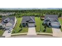 Inviting street view of a neighborhood with well-kept lawns and sidewalks at 104 Conway St, Peachtree City, GA 30269