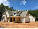 Lovely two story home featuring an elegant exterior with a covered porch and attractive architectural details at 4 Bob Smith Rd, Sharpsburg, GA 30277