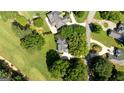 Aerial view of the property showing its location on a golf course at 595 Mcgarity Dr, Mcdonough, GA 30252