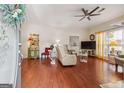 Bright and airy living room with hardwood floors and a decorative ceiling fan at 119 Holiday Road, Unit 301 Rd # 301, Buford, GA 30518