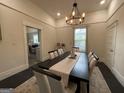 Stylish dining room showcasing an elegant light fixture at 1012 Institute Nw St, Conyers, GA 30012