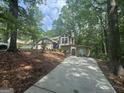 Well-maintained home with a two-car garage and lush, green surroundings at 2532 N Carroll Ct, Villa Rica, GA 30180
