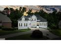 Beautiful two story home with a white exterior, black shutters and meticulously manicured lawn and driveway at 6017 Chestatee Creek Nw Ct, Acworth, GA 30101