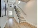 Bright entryway with hardwood floors and staircase with stylish railings at 4484 Eastbrook Pl # 54B, Snellville, GA 30039